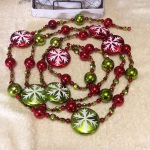 55” (4.58 feet) of Red and Green Snowflaked Plastic Bead Garland